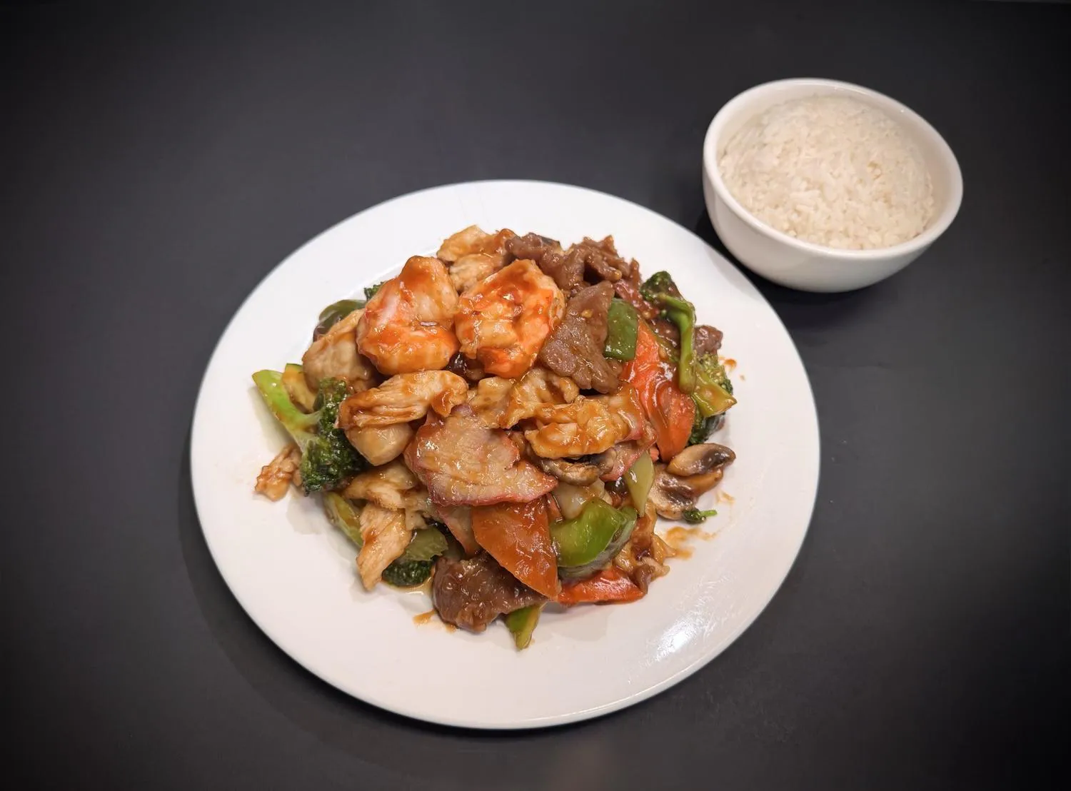 Combination stir‑fry with shrimp, chicken, pork and assorted vegetables with rice at Lucky House, a Chinese restaurant in Surprise Combination stir‑fry with shrimp, chicken, pork and assorted vegetables with rice at Lucky House, a Chinese restaurant in Surprise